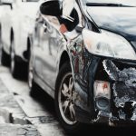 parked car with damaged fender