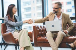 Business people shaking hands, closing a deal